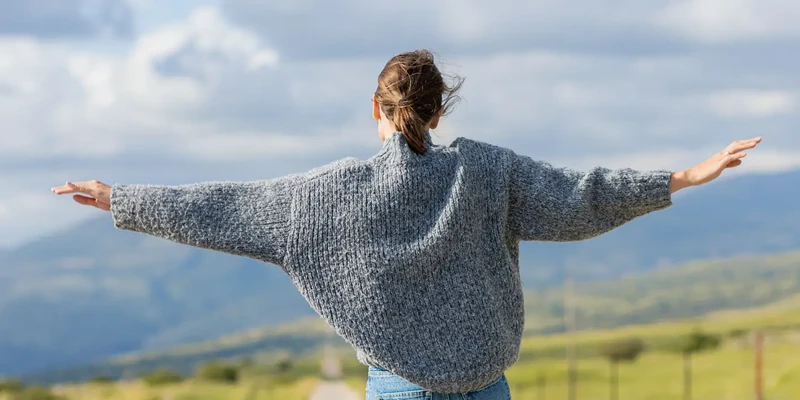 liberty environment woman gray sweater standing road enviroment