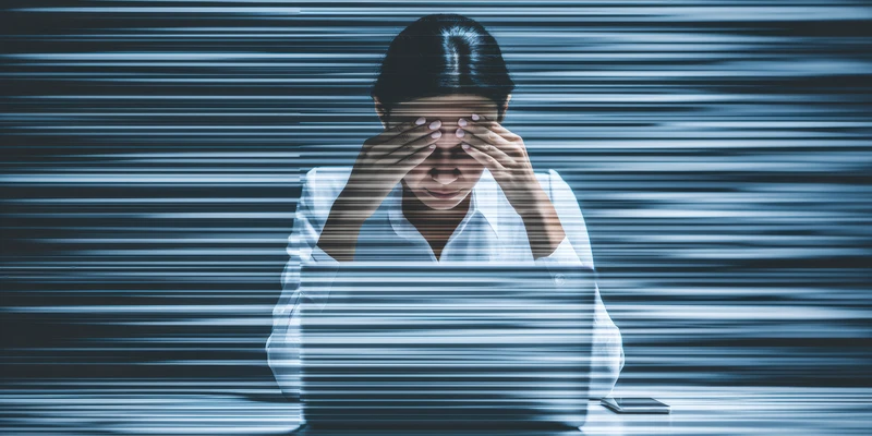 liberty mental health woman white shirt standing front dark